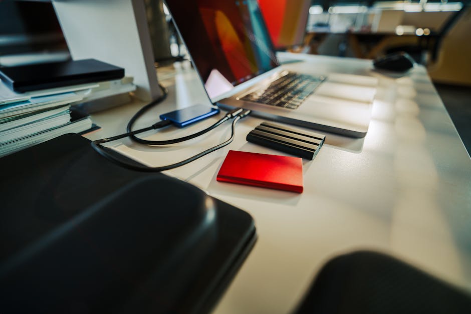 Photographer connecting external hard drives for a 3-2-1 encrypted backup setup