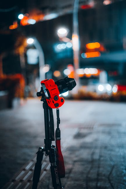 Tripod set up under a starry sky with camera aimed for night photography