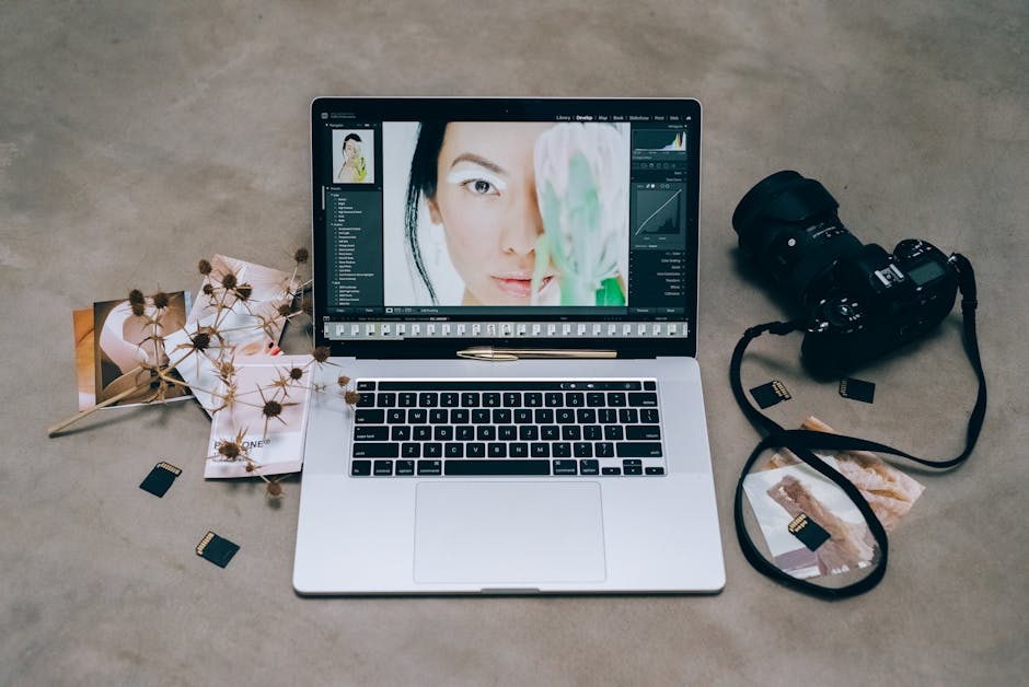 Close-up of a portrait being edited on a laptop with AI-style adjustments