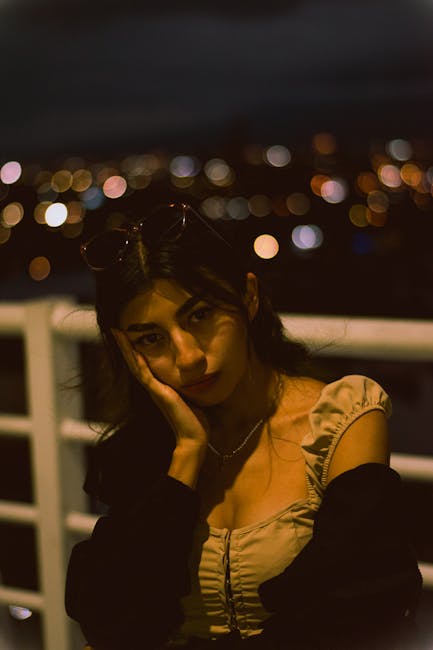 Night portrait with creamy background bokeh from street lights and shallow focus