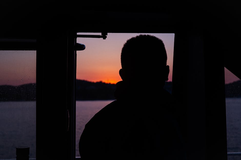 Photo of a subject in sunset backlight with sun near the frame edge, showing lens flare/contrast differences.