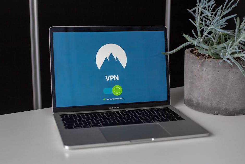 Photographer using a laptop with VPN connected on public wifi during file transfer