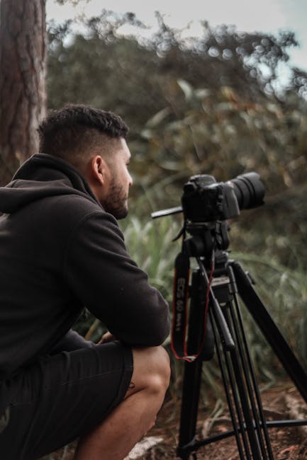 Wildlife photographer observing a missed moment as a camera buffer delay interrupts continuous shooting