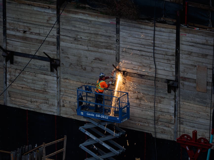 Photographer protecting camera gear on a construction site, with tips on safeguarding digital assets during assignments.