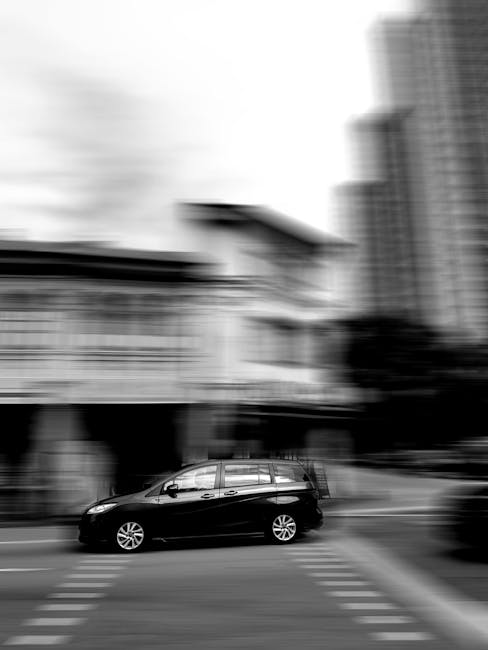 Photographer panning a car; motion blur and skew effects visible on fast edges