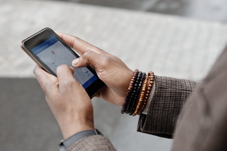 Person taking a photo outdoors while phone location is active on screen