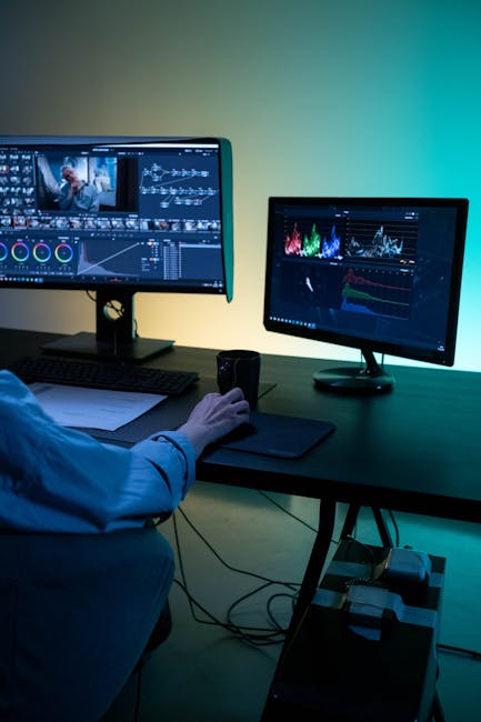 Photo culling on a laptop with folders and headset as radio plays in background.