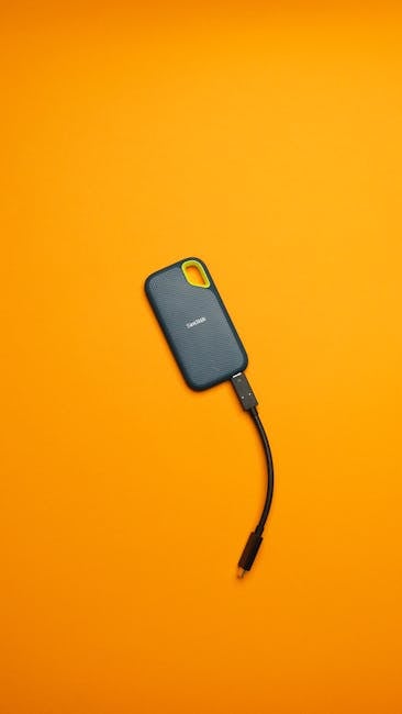 Rugged SSD and portable drives during on-site photo backup after a shoot